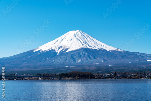 Close up top of beautiful fuji mountain with snow cover on the top and blue cleared sky in morning, kawaguchiko lake, yamanashi, japan in asia. Famous landmark of japan. Best attraction travel.