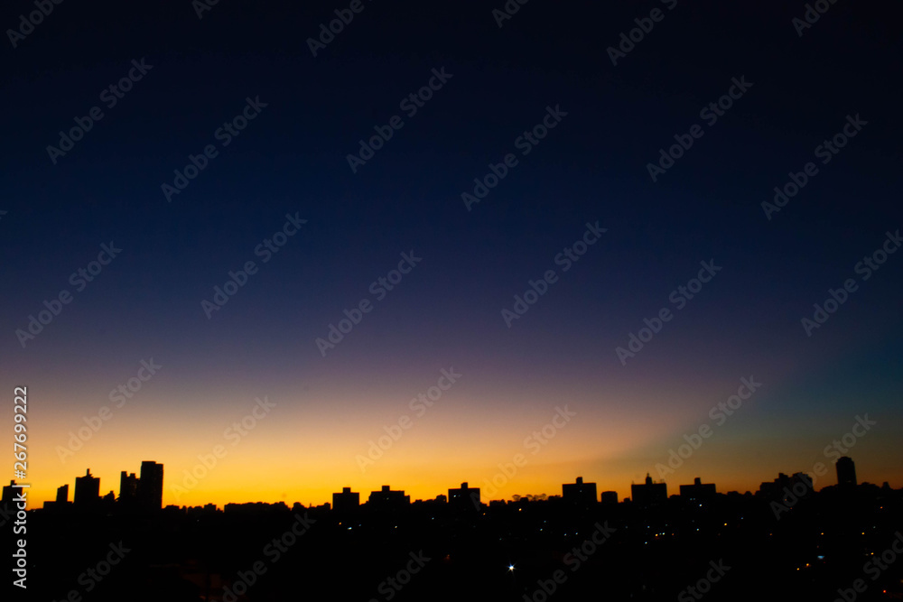 Sunset cityscape nightfall skyline