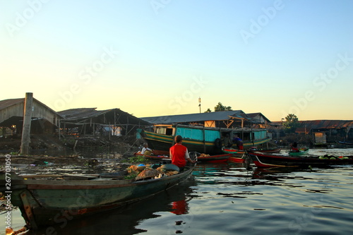 Citra Bahari Barito river floating market in the morning, full of gold from the sunrise in Banjarmasin / South Kalimantan - Indonesia, May 12, 2019