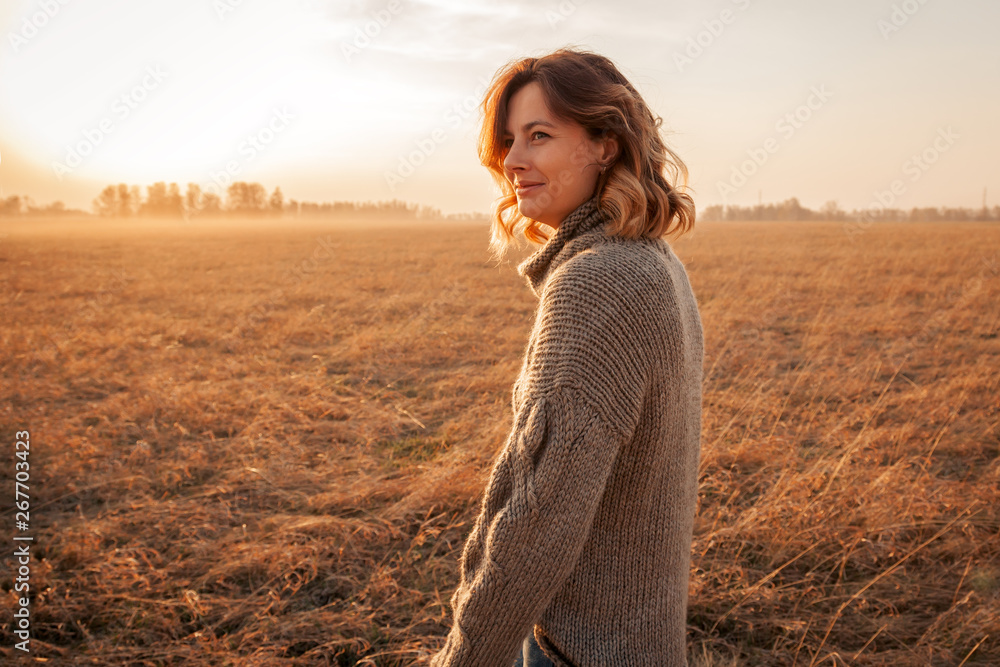 © Виталий Сова - Portrait of a beautiful young model in warm clothes enjoy day, on background field in sunny autumn day . Autumn warm photo. Woman smiling and look away, joyful cheerful mood. © Виталий Сова - Portrait of a beautiful young model in warm clothes enjoy day, on background field in sunny autumn day . Autumn warm photo. Woman smiling and look away, joyful cheerful mood.