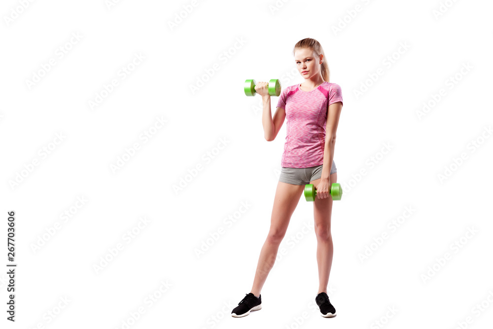 Young sportive woman fitness model blonde doing exercise with dumbbell on biceps on white isolated background. Fit girl living an active lifestyle Young sportive woman fitness model blonde doing exercise with dumbbell on biceps on white isolated background. Fit girl living an active lifestyle