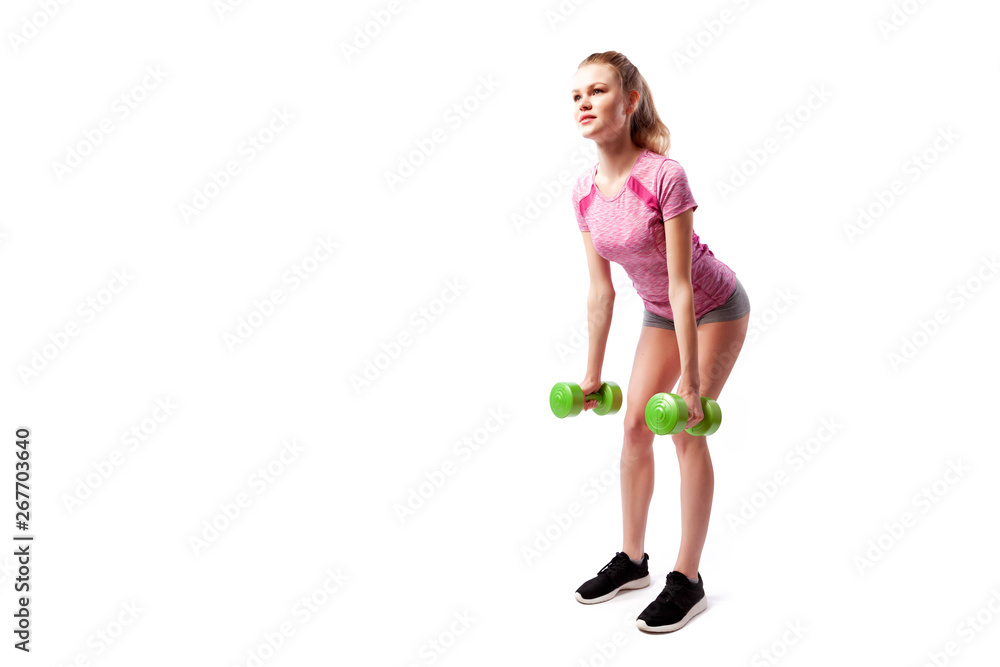 Young woman in sports clothes makes deadlift with weights dumbbell in semi-sitting position on white isolated background. Side view.Fit girl living an active lifestyle Young woman in sports clothes makes deadlift with weights dumbbell in semi-sitting position on white isolated background. Side view.Fit girl living an active lifestyle