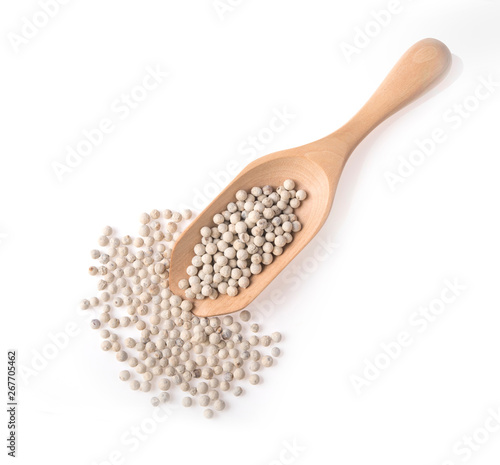 Peppercorns in spoon wooden top view on white background