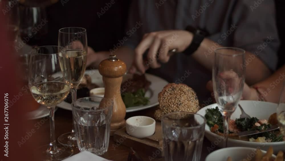 People eating and drinking in a gastropub in London People eating and drinking in a gastropub in London