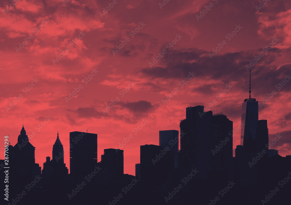 Downtown skyline buildings at sunset in Manhattan, New York City in red Downtown skyline buildings at sunset in Manhattan, New York City in red