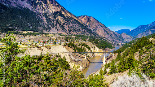 Railway bridge over the Fraser River along Highway 99, as the river flows though a canyon to the town of Lillooet in the Chilcotin region on British Columbia, Canada