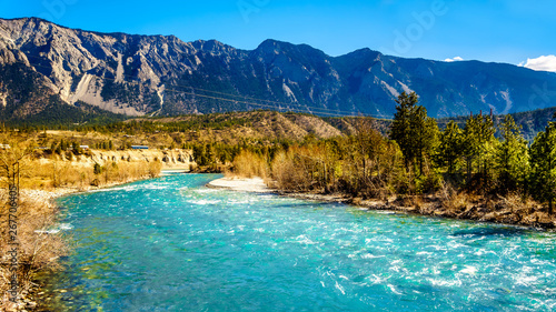 The clear turquoise waters of the Cayoosh Creek just before it runs into the Fraser River at the town of Lillooet in British Columbia, Canada