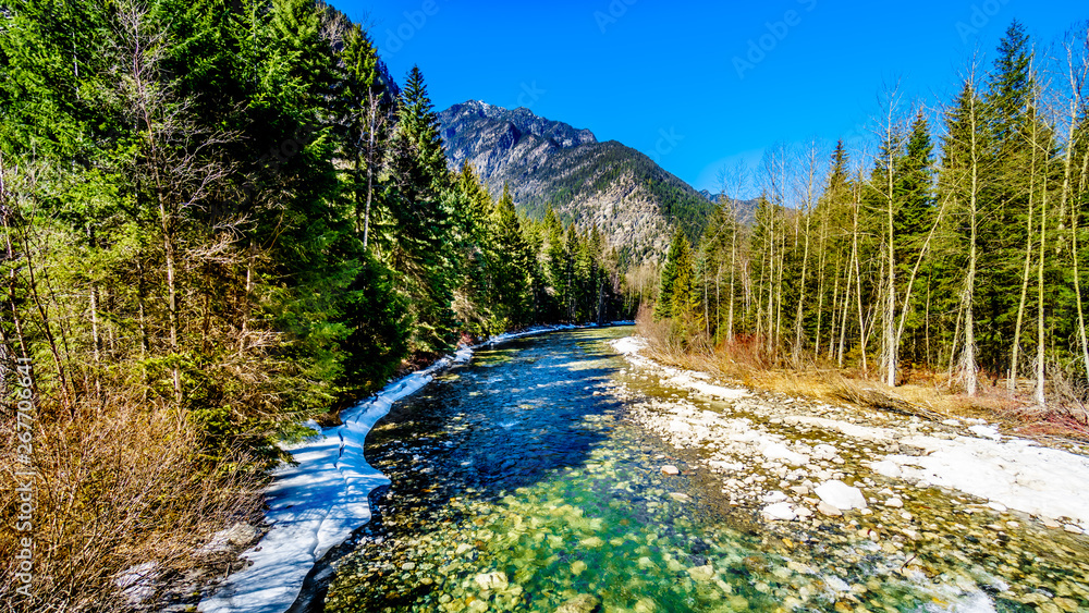 Partly frozen Cayoosh Creek which runs for the most part next to Highway 99, the Duffey Lake Road, between Pemberton and Lillooet in southern British Columbia, Canada Partly frozen Cayoosh Creek which runs for the most part next to Highway 99, the Duffey Lake Road, between Pemberton and Lillooet in southern British Columbia, Canada