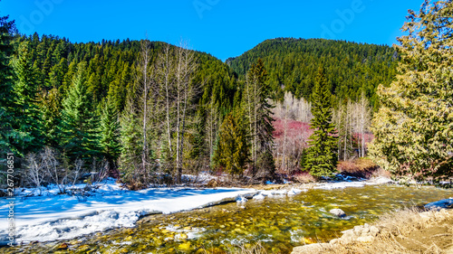 Partly frozen Cayoosh Creek which runs for the most part next to Highway 99, the Duffey Lake Road, between Pemberton and Lillooet in southern British Columbia, Canada photo