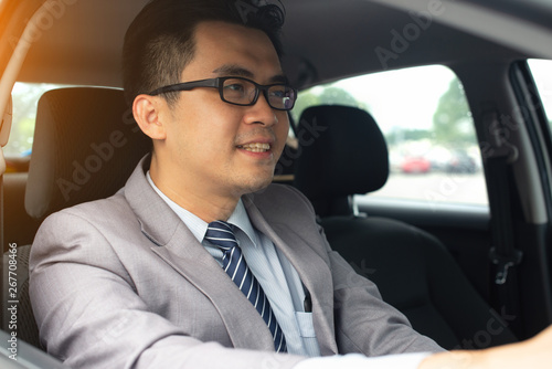 happy young business man driving in the car © wong yu liang