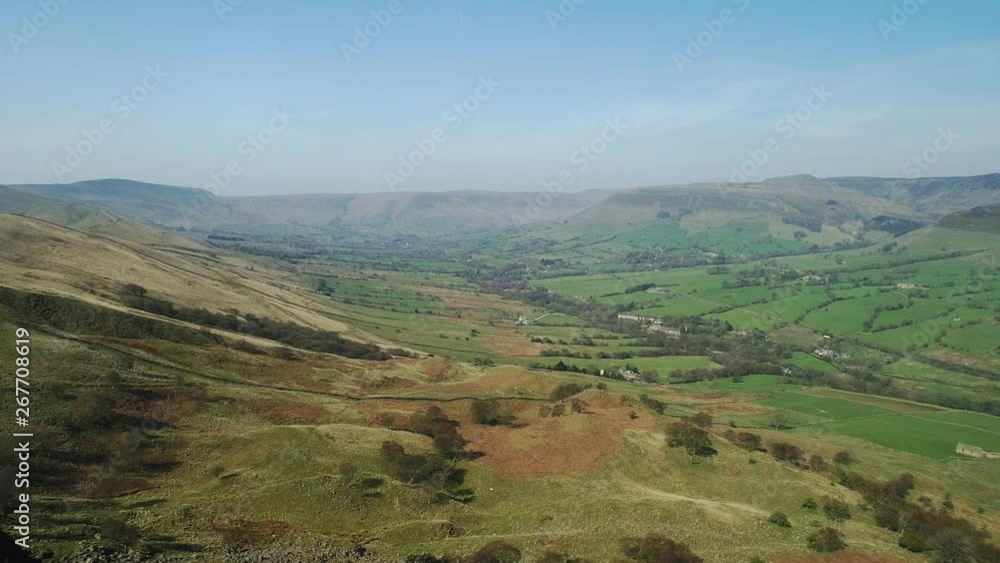 Aerial shot of the Edale village at the bottom of the valley from the top of on of the Hill Peaks, Peak District, UK. Aerial shot of the Edale village at the bottom of the valley from the top of on of the Hill Peaks, Peak District, UK.