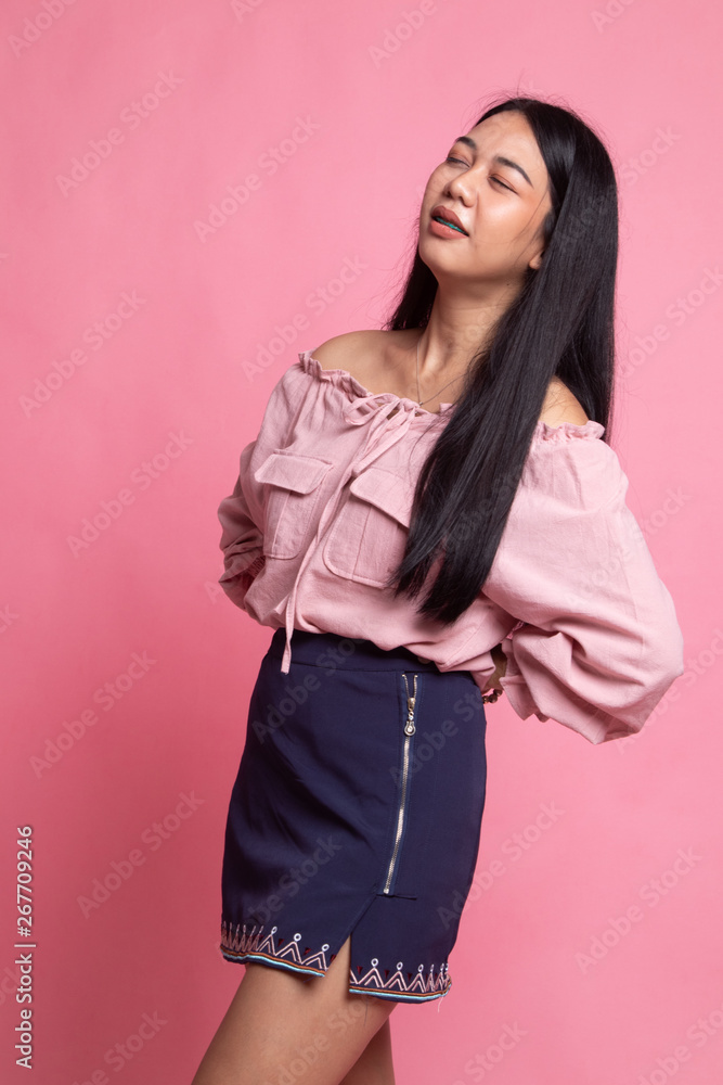 Young Asian woman got back pain. Young Asian woman got back pain.