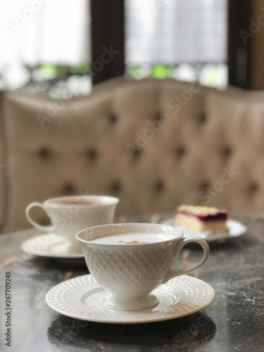 Fototapeta Naklejka Na Ścianę i Meble -  Coffee cup on table in coffee shop