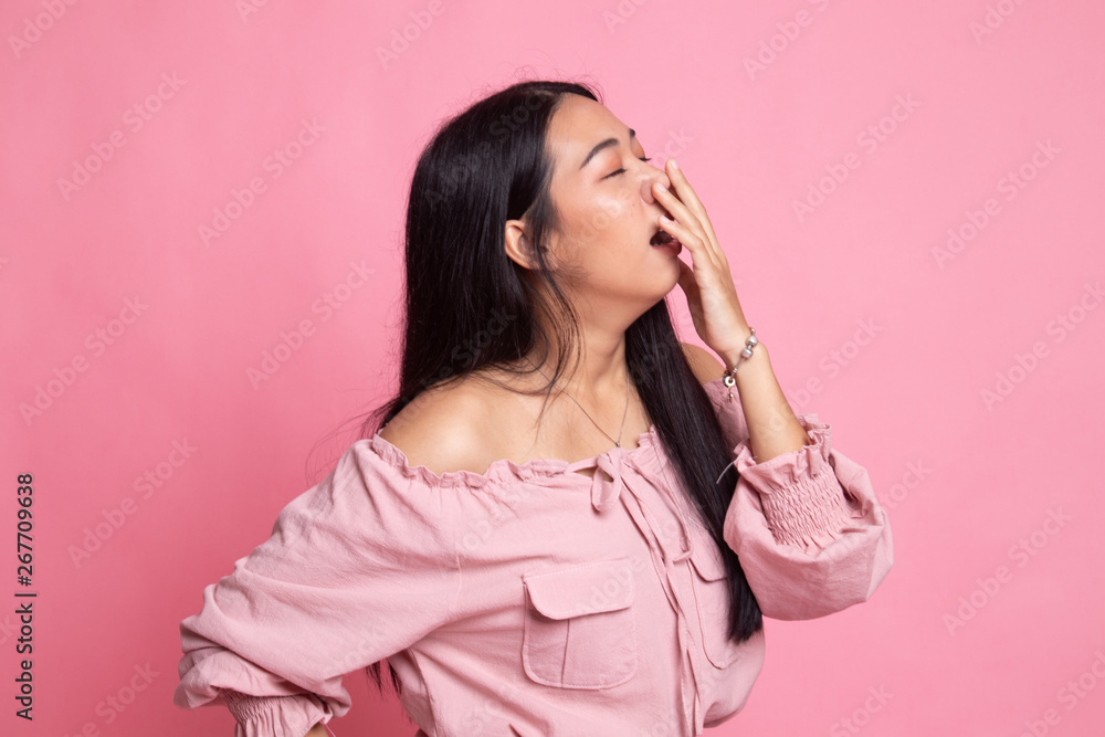 Sleepy young Asian woman yawn. Sleepy young Asian woman yawn.