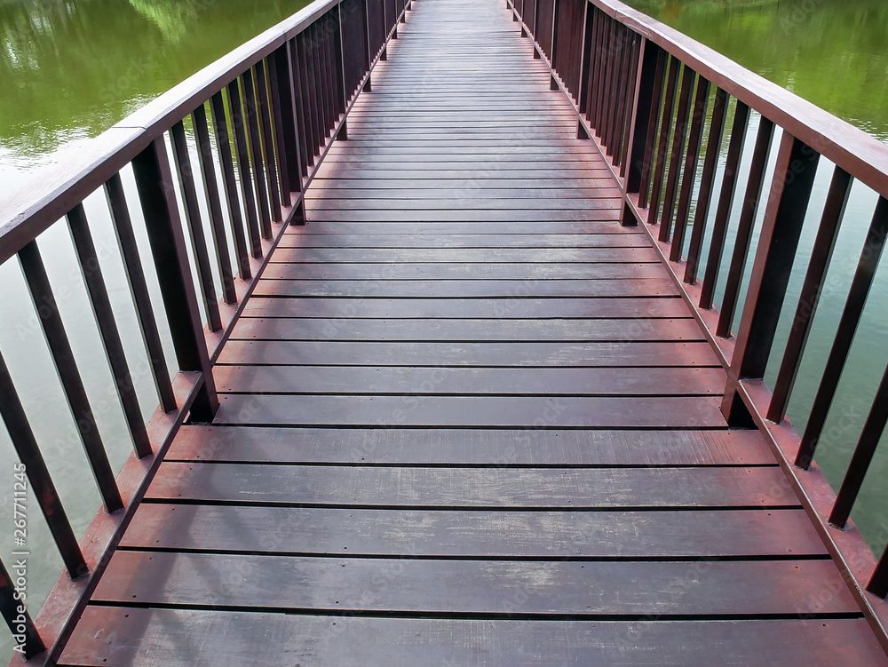 Retro Asian Architectural Design of Wooden Planks Bridge in the Lake