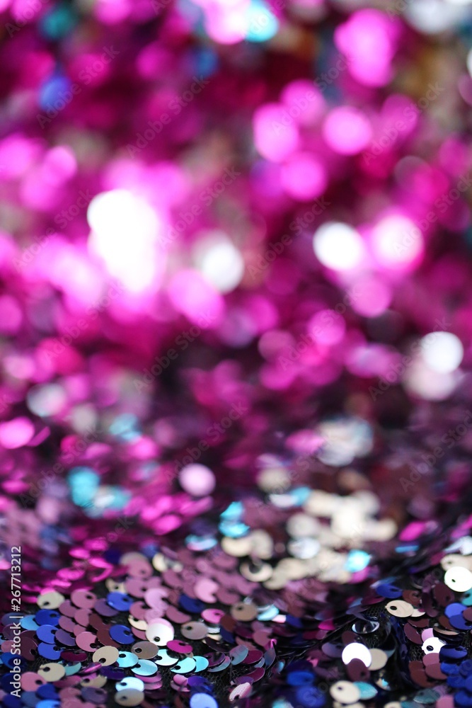 Sequins   multicolored blurred bokeh background.Shine fabric sequin. 
