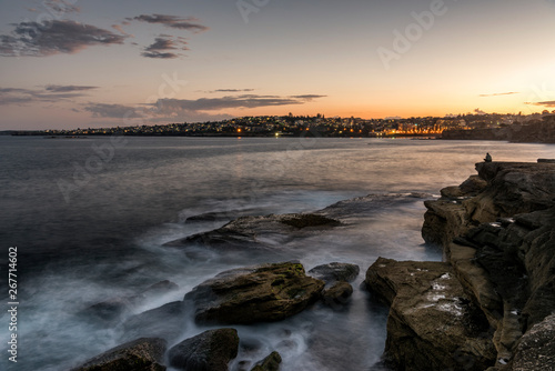 Clovelly coastline looking at night lights of Coogee beach Australia at sunset. © BChong