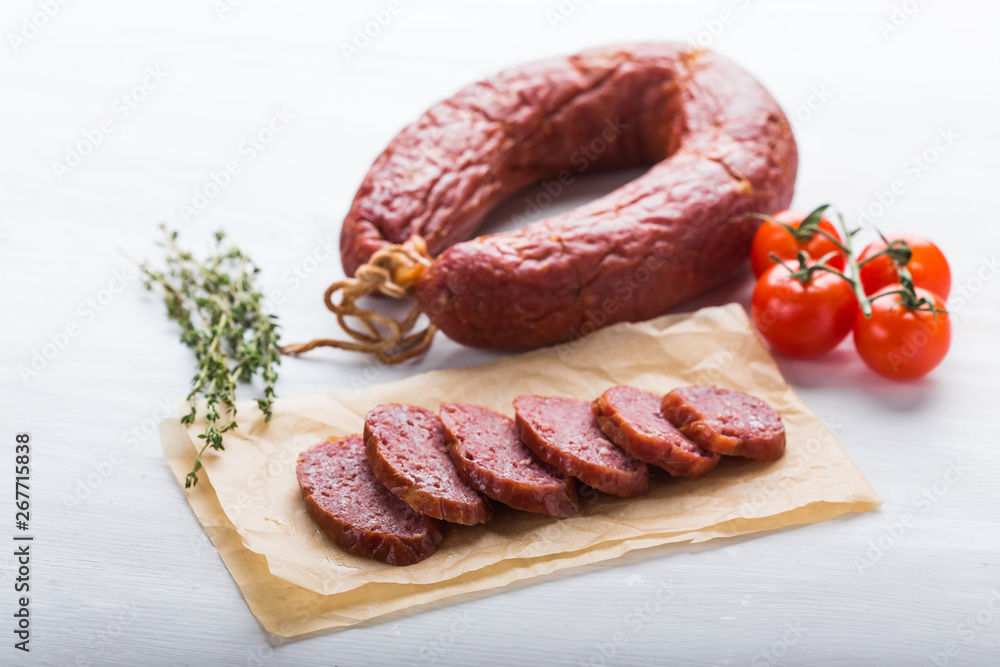 Food, meat and delicious concept - sausages made with horse meat with species and vegetables Food, meat and delicious concept - sausages made with horse meat with species and vegetables
