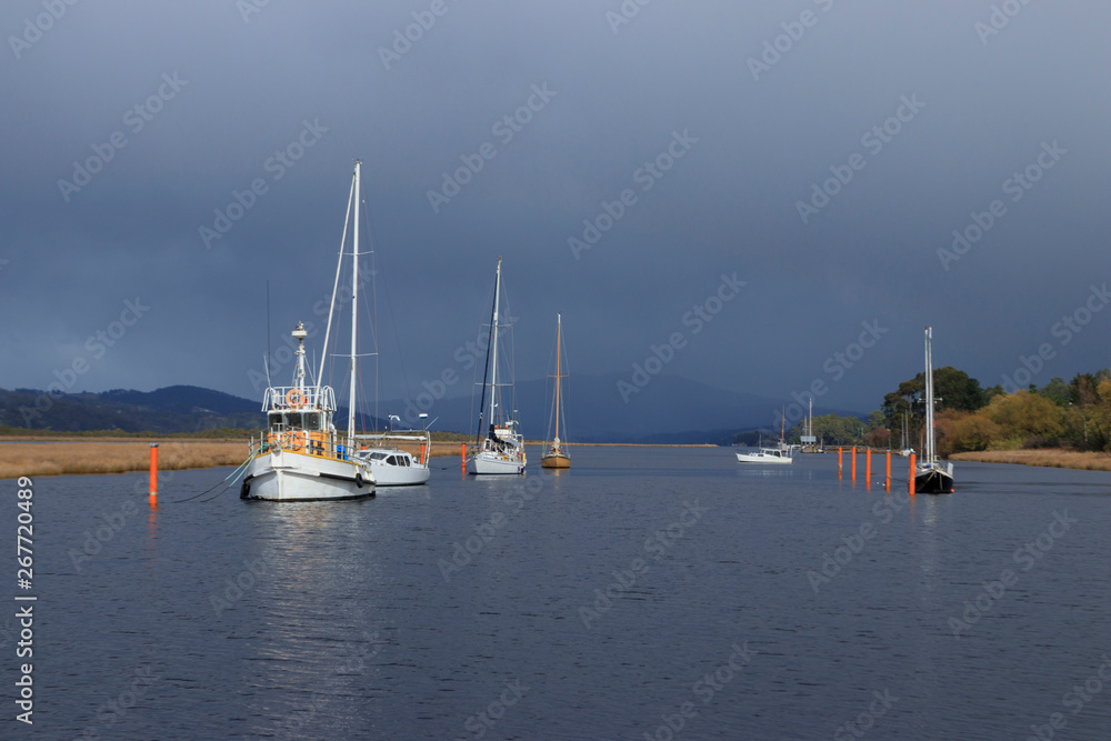 Boats moored on Huon River at Franklin Tasmania