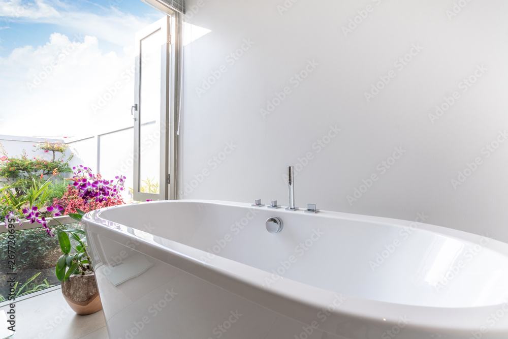 © Stock PK - Luxury bathroom features bathtub with flower © Stock PK - Luxury bathroom features bathtub with flower