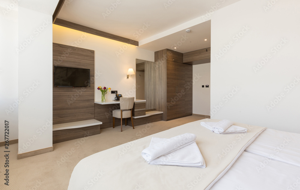 Interior of a modern double bed hotel bedroom Interior of a modern double bed hotel bedroom