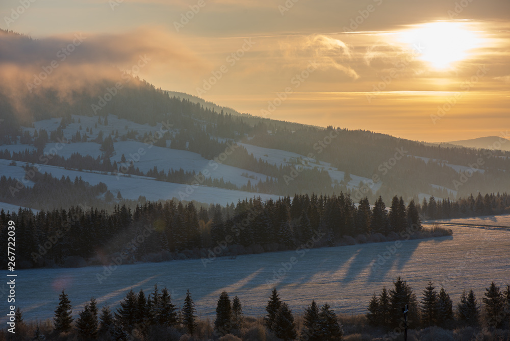 beautiful sunrise in winter in the mountains