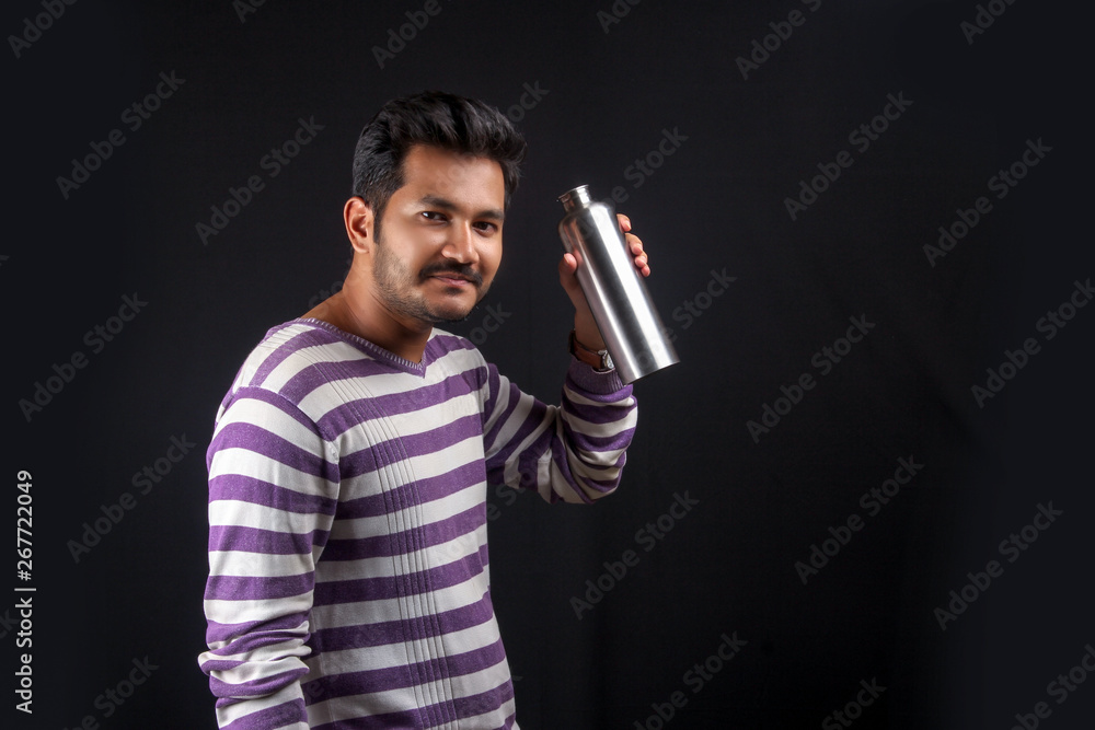 Indian man showing drinking water bottle Indian man showing drinking water bottle