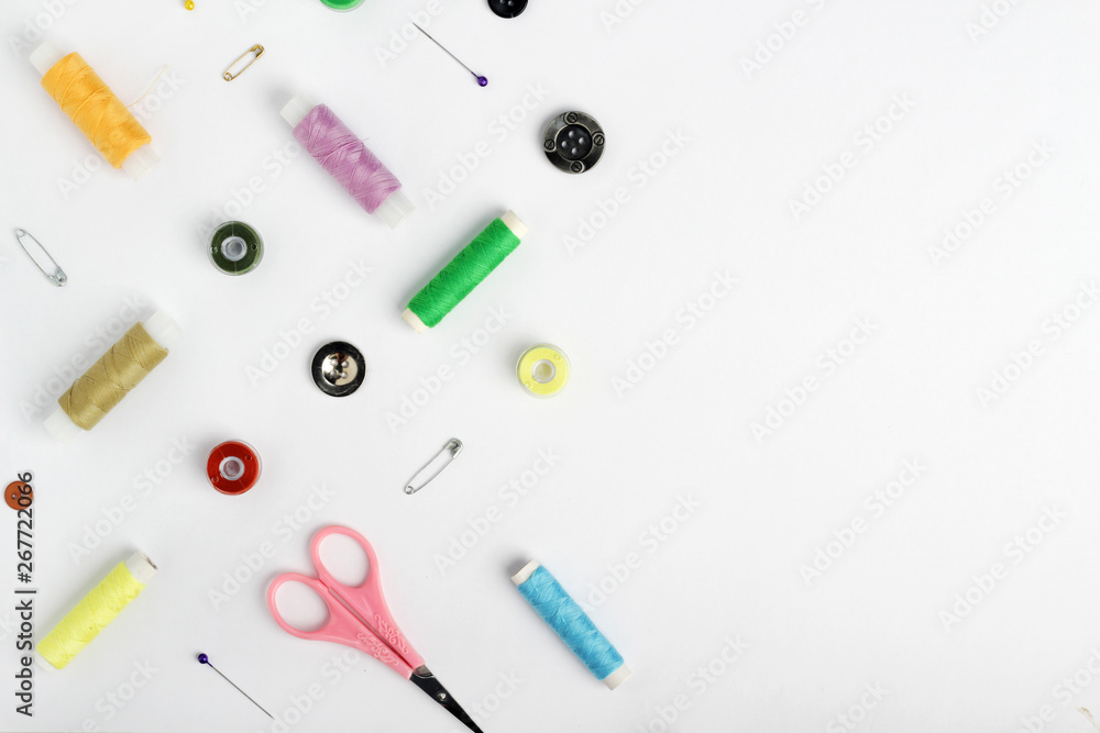 White background with different tools for sewing and tailoring White background with different tools for sewing and tailoring