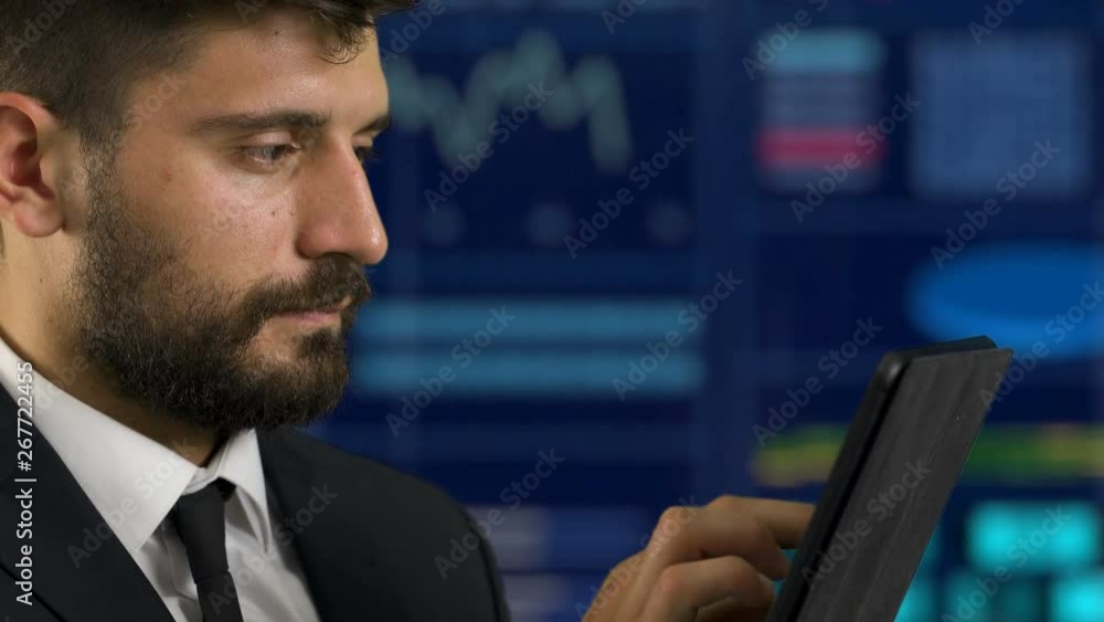 The man working with a tablet on the virtual screen background The man working with a tablet on the virtual screen background