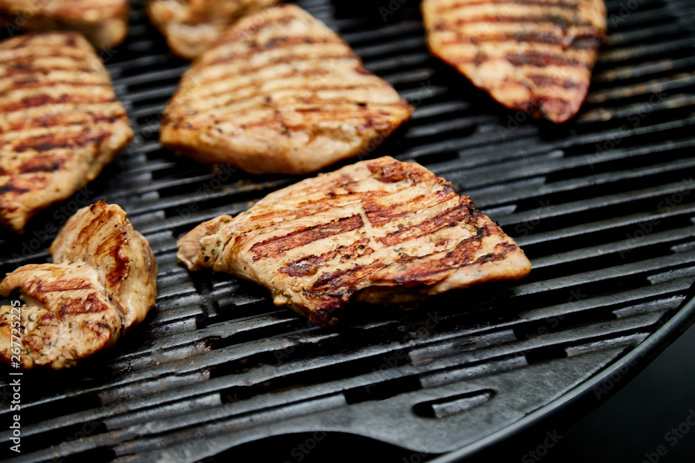 Grilled turkey meat. Steak turkey grill on on huge gas grill . Picnic. Summer. Top view. Flat lay. Copy space.