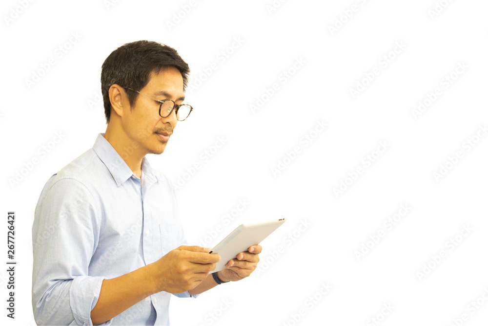 Asian man with eyeglasses looking at tablet isolated in clipping path.