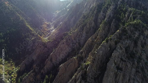 Aerial dolly shot over large rugged granite cliffs in Cottonwood Canyon