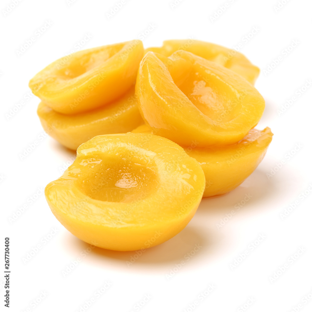 peaches in syrup on a white background peaches in syrup on a white background