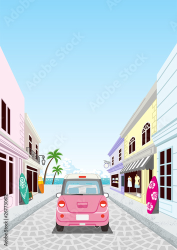 Driving retro pink car in the Seaside street ,rear view