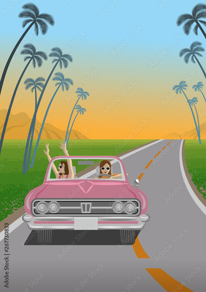 Two young women enjoying summer drive by the pink convertible in roadway at sunset