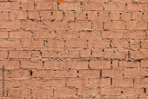 Old vintage painted brick wall. Textured outdoor background.