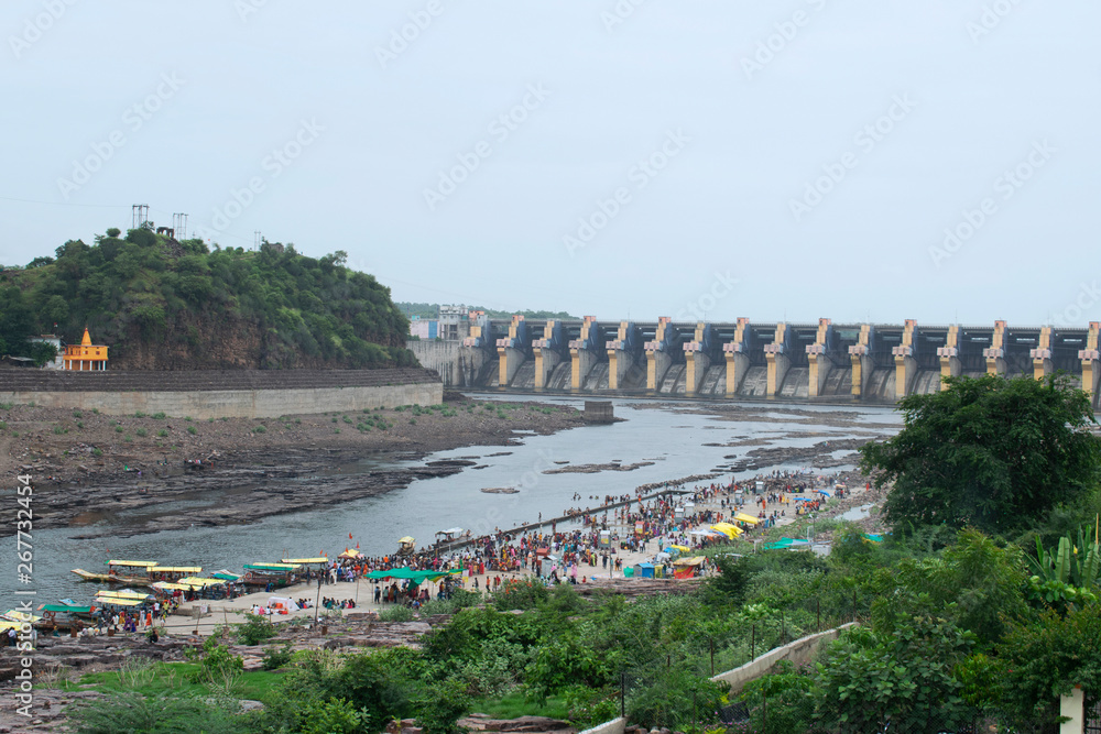 OMKARESHWAR, MADHYA PRADESH, INDIA, August 2018, Tourist and devotees at Omkareshwar temple with view of dam on Narmada River.