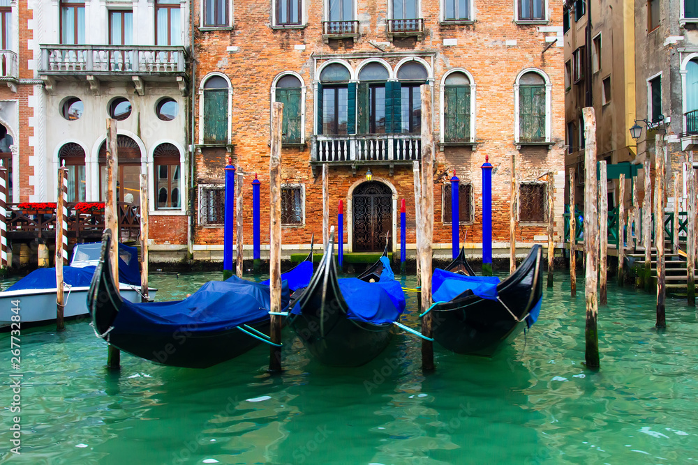Venice, Italy. Gondolas in Grand Canal near old house. Venice Down Town