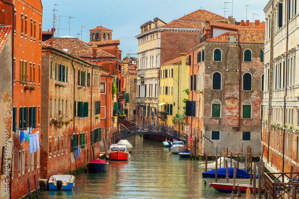 Venice cityscape, Italy. Old Venice town with boats in water canal