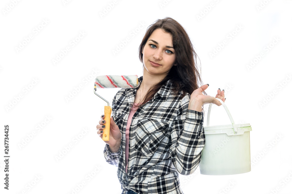 Woman with paint in bucket and tools isolated on white Woman with paint in bucket and tools isolated on white