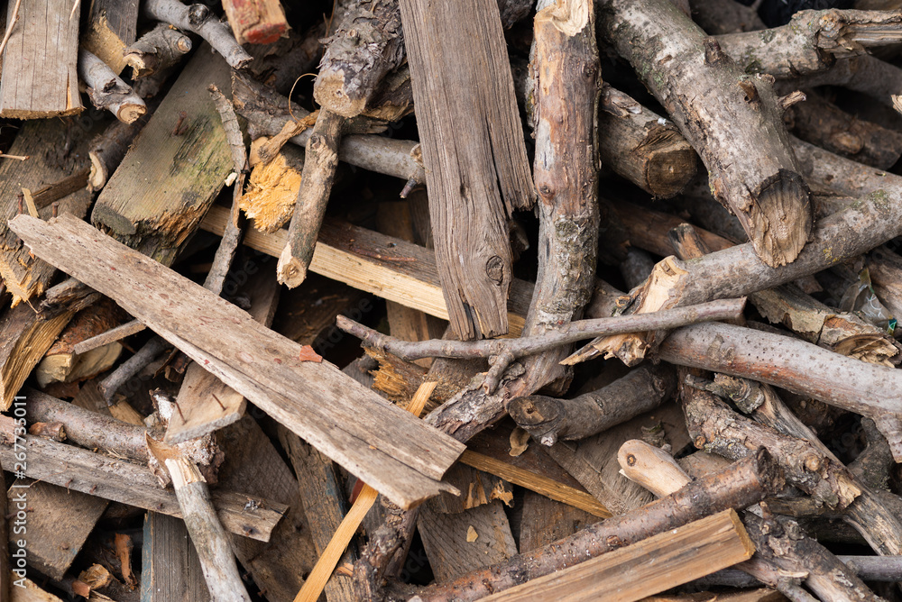 Firewood for home heating and kindling. Firewood for the stove. Background with wood texture. Firewood for home heating and kindling. Firewood for the stove. Background with wood texture.