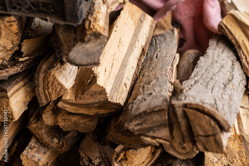 Firewood for home heating and kindling. Firewood for the stove. Background with wood texture.