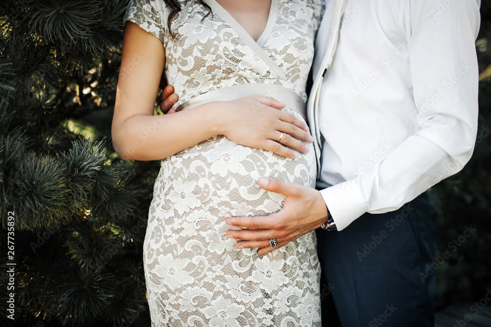Man and woman expecting baby. Close up image of belly . Man and woman expecting baby. Close up image of belly .