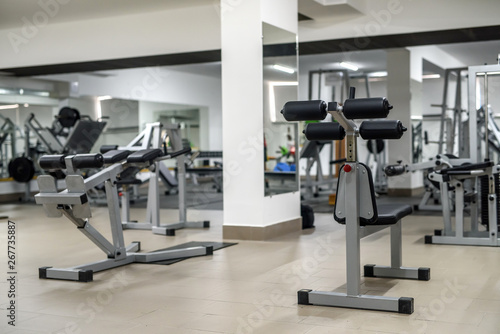 Modern interior of light gym with different equipment