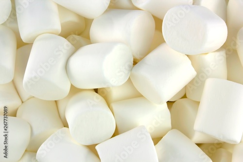 White marshmallows as background. Fluffy marshmallows texture.