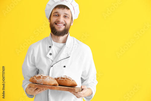 Young baker with fresh brea...