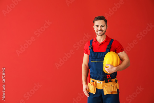 Male electrician on color b...