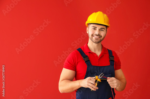 Male electrician on color b...