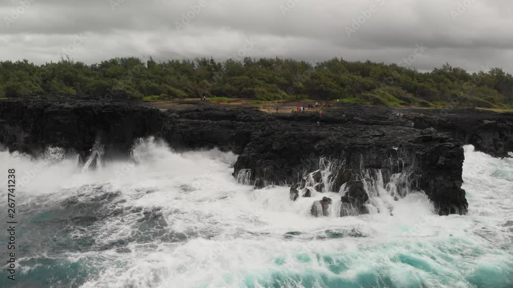 Pont Naturel in Mauritius. Aerial view on a stormy day, slow motion Pont Naturel in Mauritius. Aerial view on a stormy day, slow motion