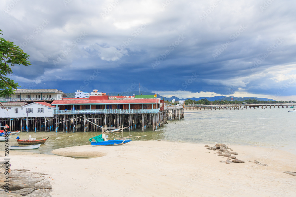 Boats on the beach and restaurants on stilts